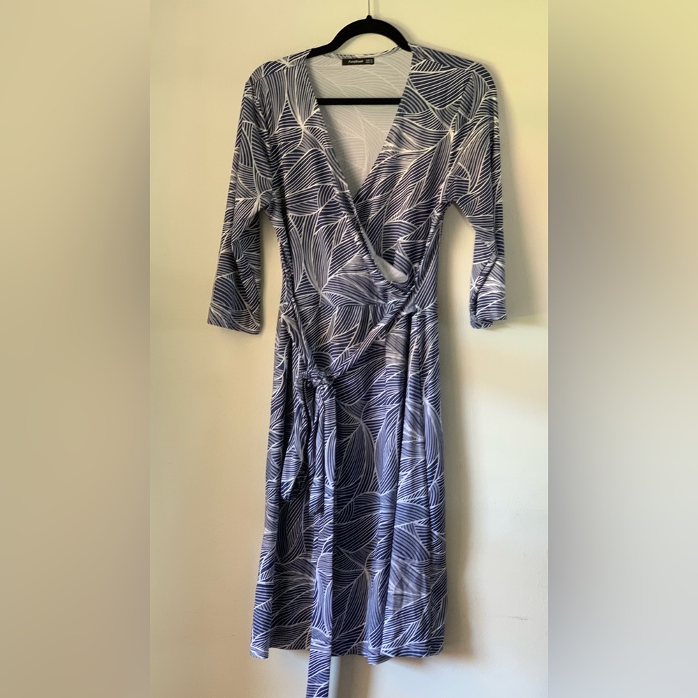 Blue and white wrap dress. 3/4 sleeve.